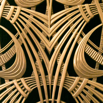 Gold Art Deco fan geometry pattern on black background