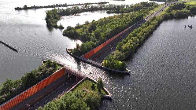 Veluwemeer Aqueduct, road crosses under a waterway in the Netherlands. Innovative intersection of highway and Water Bridge.
