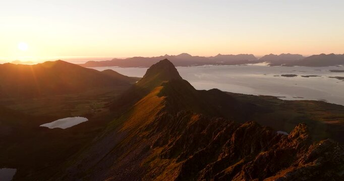 Sunset aerial view of Storheia mountain ridge popular for hiking, Stokmarknes