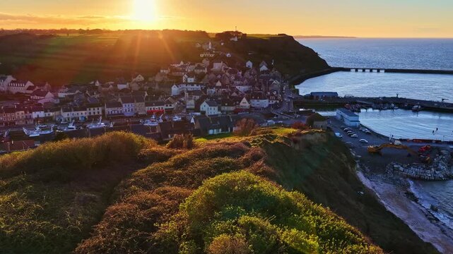 Elevated orbit view of Port en Bessin landscape in morning sun