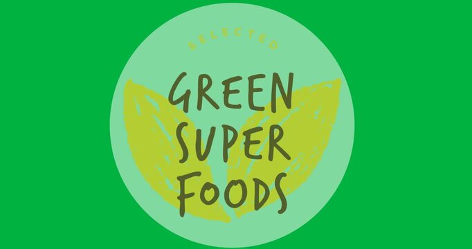 Digital animation of green super foods text over a grey round banner on black background