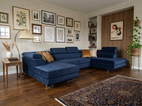 Blue Sectional Sofa in Modern Living Room with Gallery Wall