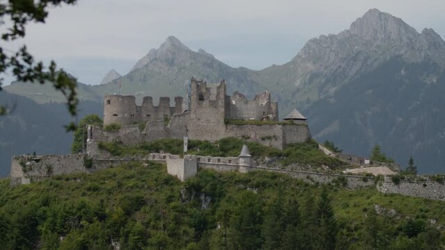 Ruins of Ehrenberg Castle in Austria. Historical architecture of the castle on top of a mountain in the alpine landscape.