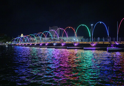 Night View of Colorfully Illuminated Queen Emma Bridge