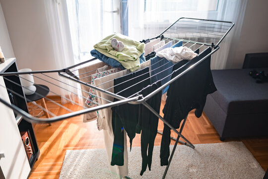 Drying laundry on a rack at home.