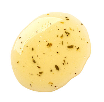 Italian vinaigrette salad dressing puddle with herbs