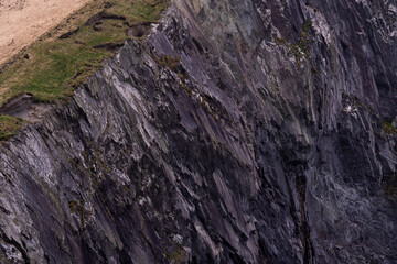 Fototapeta premium Vertical rock cliff texture detail in Irish coastal landscape