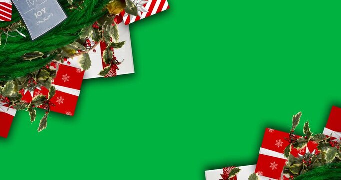 Christmas wreath, gift boxes and cards with copy space on black background
