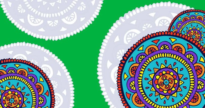 Digital animation of colorful abstract design pattern spinning against black background