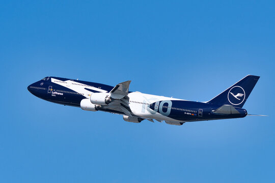 Lufthansa Boeing 747-8 (D-ABYN) passenger plane in special 100th anniversary livery taking off at Haneda Airport.