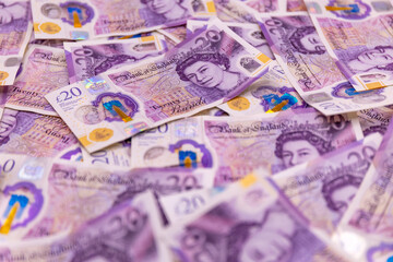 Obraz premium A background with many 20 pound banknotes, british currency, Elizabeth II