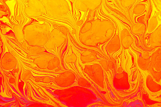 Colorful abstract Ebru marbling background with vibrant liquid ink swirls