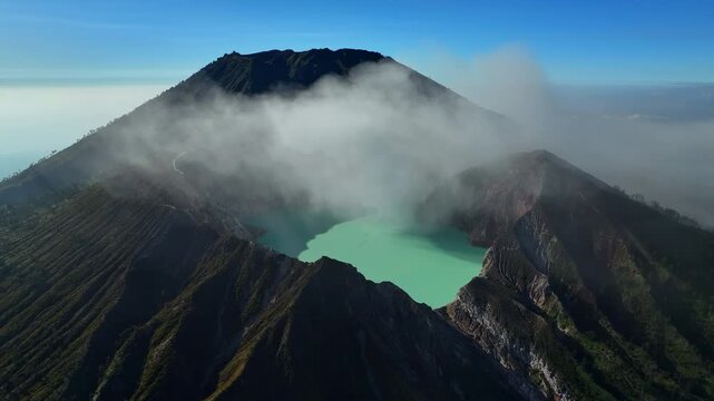 Aerial view drone orbit around to reveal Kawah Ijen volcano crater, Indonesia
