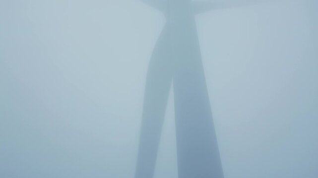 Rear View of Wind Turbine Nacelle with Open Hatch in Thick Fog