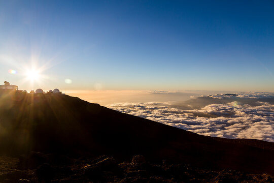 Haleakala observatory above the clouds at sunrise Maui Hawaii