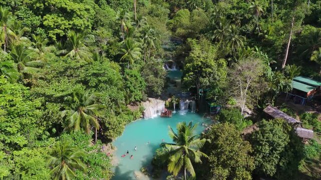 Aerial of Siquijor Philippines Cambugahay Falls turquoise lagoon and tropical jungle in
