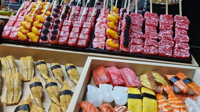 Sushi and Meat Skewers on Display at Street Market, Traditional Japanese Food