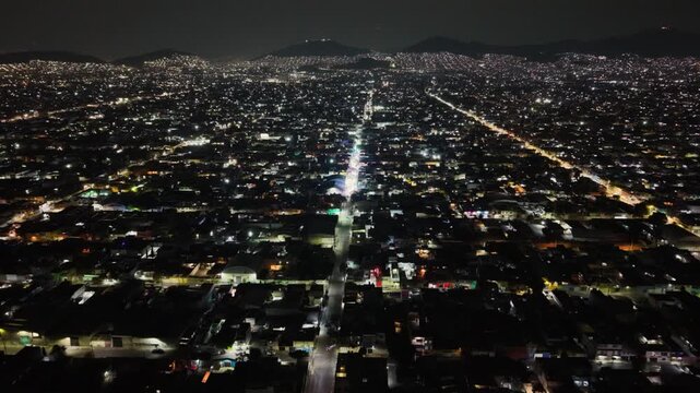 Aerial perspective of residential zones and traffic in Ecatepec at night