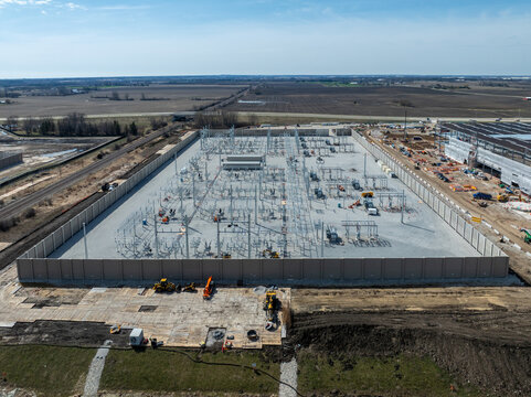 Mount Pleasant, Wisconsin, USA - April 11, 2026: Aerial view of Microsoft data center under construction with electrical substation infrastructure.