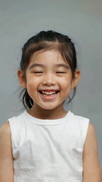 Close-up of a smiling little girl, close-up of a little girl's multi-angle smiling face