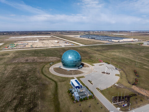 Mount Pleasant, Wisconsin, USA - April 11, 2026: A glass sphere building stands at the Foxconn development site, surrounded by open land and ongoing campus development.