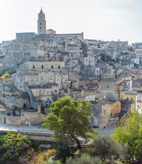 Obraz premium Matera, Italy: Ancient stone buildings and bell tower in Matera