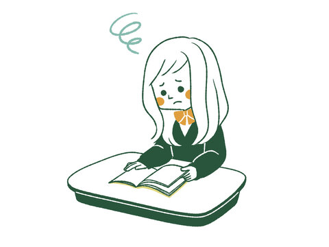 席で本を読んでいる困った表情の女子学生