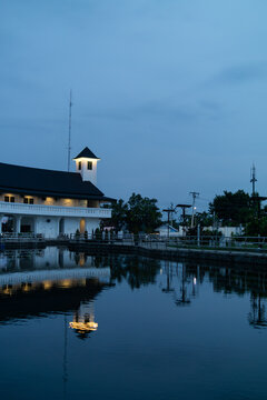 Stunning night reflection of Graha Budaya building in Embung Giwangan, Yogyakarta, Indonesia.