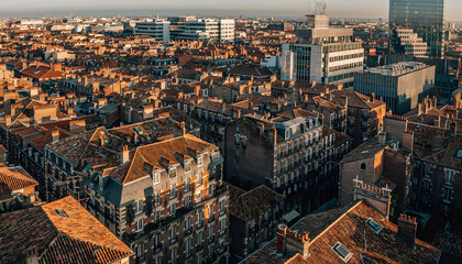 Fototapeta premium Golden hour cityscape overlooking historic European rooftops