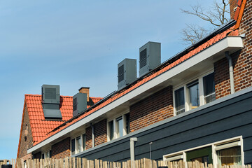 Obraz premium Energy Efficiency And Home Ventilation Exterior View Of Residential Buildings With Ventilation Systems In Wormerveer Netherlands