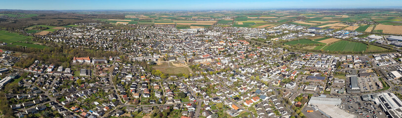 Fototapeta premium An Aerial view around the old town beside the city Rheinbach in the Germany on a cloudy spring day