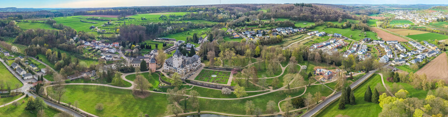 Fototapeta premium Aerial view of the village Colmar-Berg in Luxembourg on a cloudy afternoon in late winter.