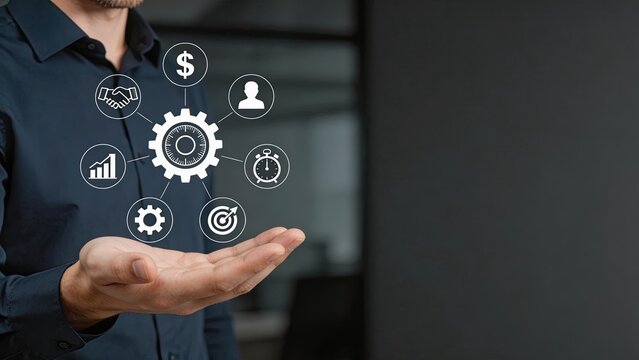 Businessman hand holding digital gear icon with symbols of finance time partnership growth and strategy for modern corporate management innovation and technology solutions in a