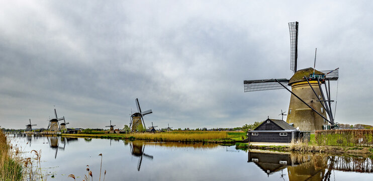 Traditional Dutch windmills on a cloudy day with gloomy light at Kinderdijk, Netherlands
