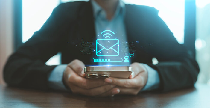 AI business email internet marketing concept hands using smartphone with digital hologram envelope mail robot chatbot loading bar wireless icons automated reply smart communication digital campaign