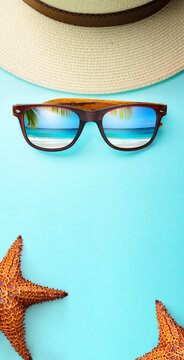 art Tropical Island Vacation Concept Sunglasses Reflecting Beach Hat And Starfish On Blue