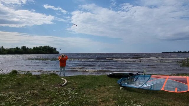 In very windy and cloudy weather. Kitesurfing on the Rybinsk Reservoir