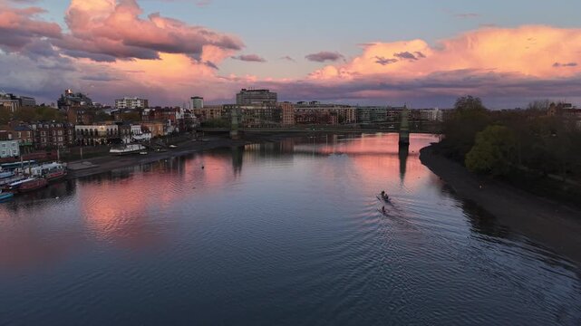 London, UK - April 20 2026: 4K aerial drone footage of Hammersmith Bridge and the Thames at sunset