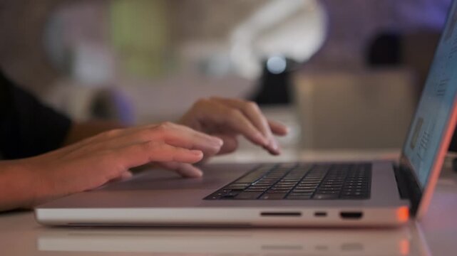 female hands typing on laptop at home in warm light, remote work and online communication, writing text on computer, modern digital lifestyle and freelance. Woman typing on laptop