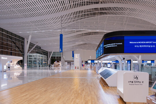 April 14, 2026, Incheon, South Korea - Interior view of Incheon International Airport Terminal 2 with information screens and baggage repack area