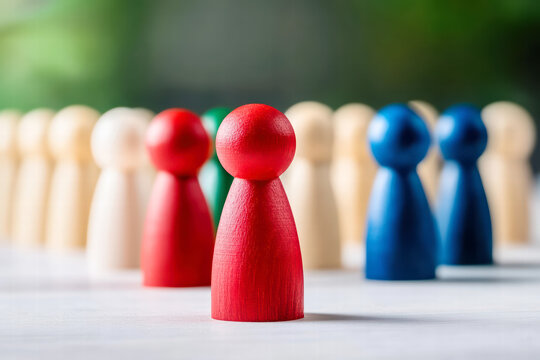 Lone red pawn contrasts with blue and beige pawns