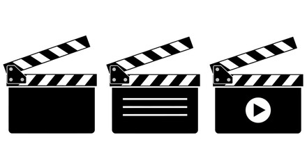 A collection of three black and white clapperboards, representing the film industry and movie production process © HUANG