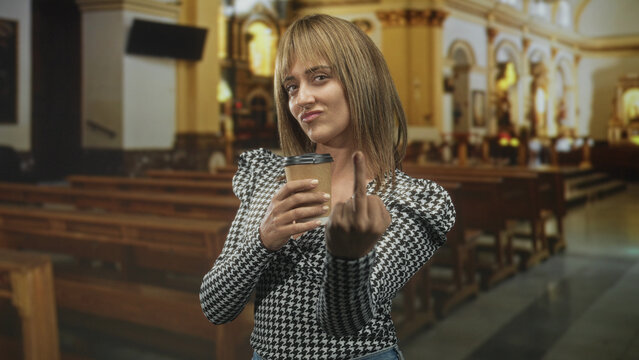 Woman holding a coffee cup shows middle finger in a church building with pews and altar visible; defiance provocation.