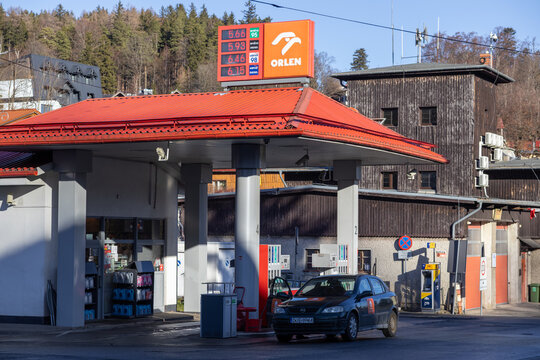 Szklarska Poreba, Poland - December 18, 2025: Orlen branded fuel station and car at pumps, representing European energy infrastructure for convenient road travel