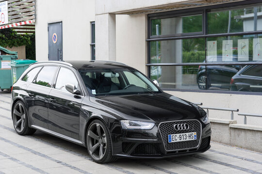 Nancy, France - May 12th 2020 : View on a black Audi RS4 Avant B8 parked on a street next to a building.