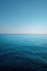 Fototapeta premium Infinite ocean meets clear sky at horizon