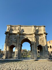 Obraz premium Arch of Constantine and Colosseum in Rome, Italy