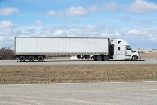 Heavy Cargo on the Road. A truck transporting cargo along a highway. Taken in Alberta, Canada