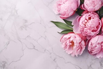 Obraz premium Pink peonies and green leaves decorating a clean white marble surface, offering elegant copy space
