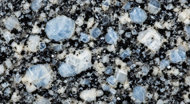 A close-up view of a speckled granite stone surface with blue and white crystals